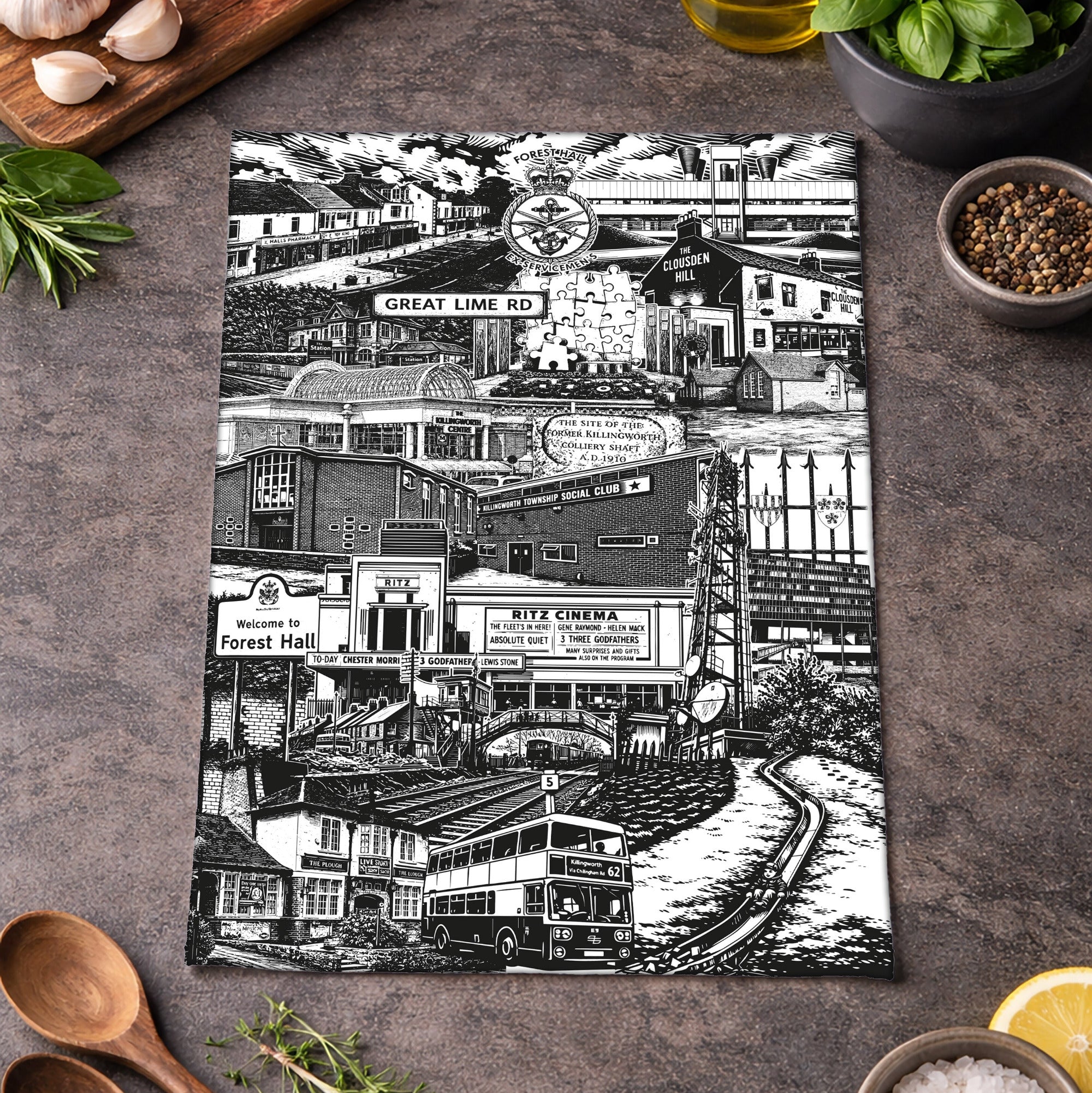 Black and white collage placemat on a rustic kitchen counter with ingredients.