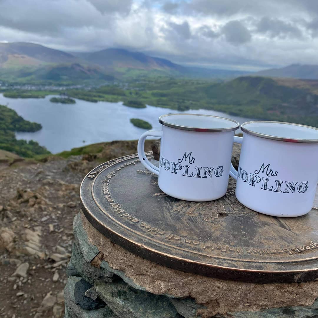 Metal camping mugs with lake district back ground