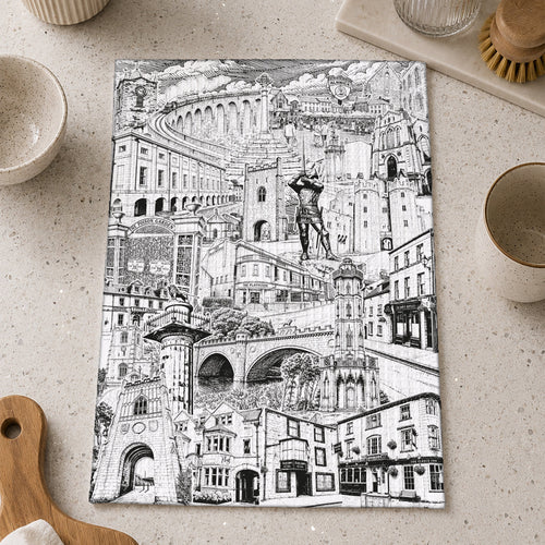 A rectangular kitchen towel with Alnwick Northumberland montage