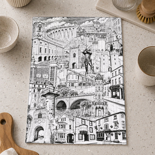 A rectangular kitchen towel with Alnwick Northumberland montage