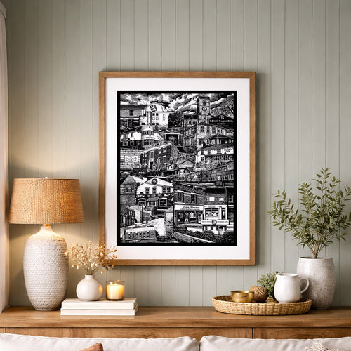 Living room with a sofa, lamp, and framed artwork on a wooden shelf.