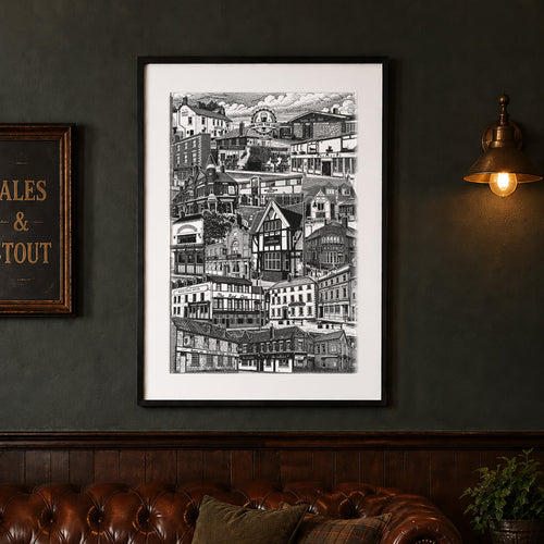 Framed black and white artwork on a dark wall above a brown leather sofa with a glass of beer.