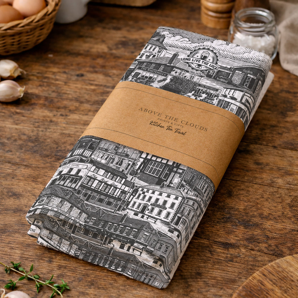 Kitchen towel with architectural design on a wooden surface