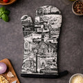 Oven mitt with architectural design on a kitchen counter with ingredients
