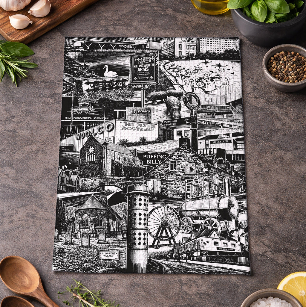 Black and white collage of vintage scenes on a kitchen towel, surrounded by kitchen items.