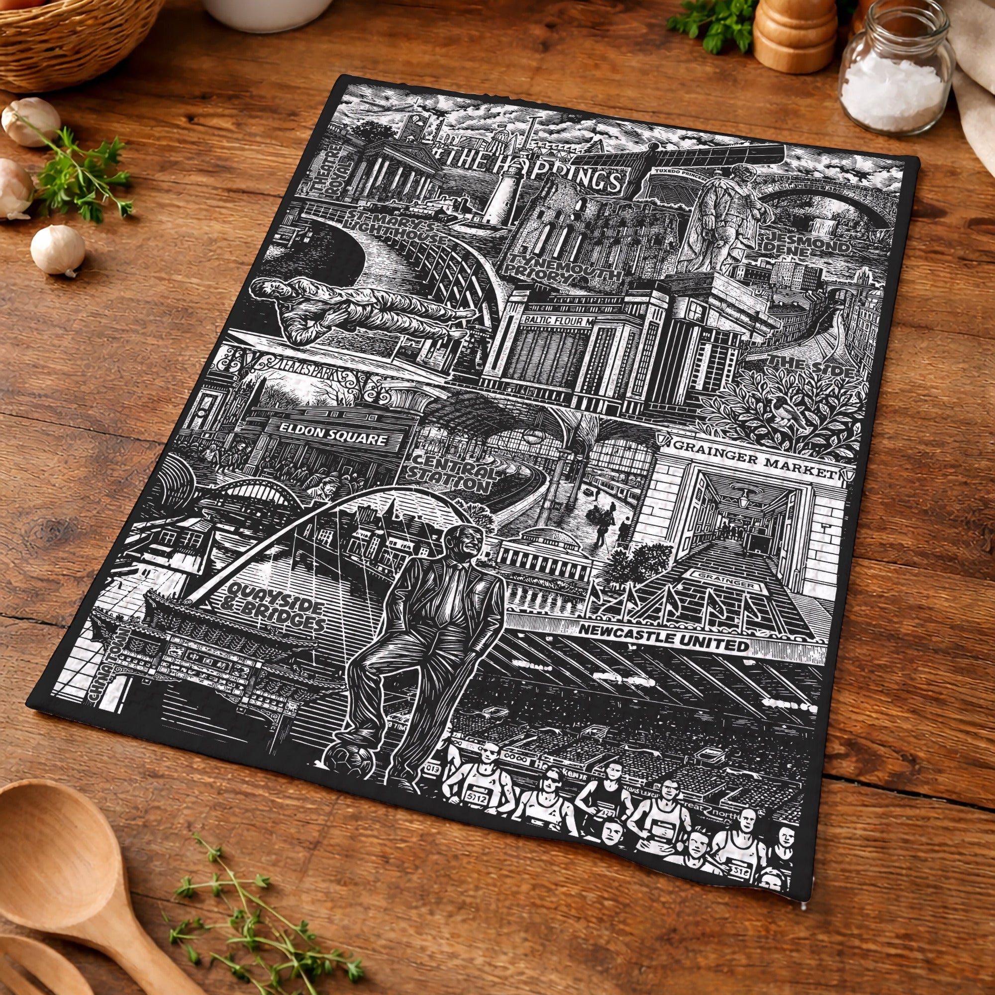 Black and white collage of urban scenes on a wooden bench with kitchen items