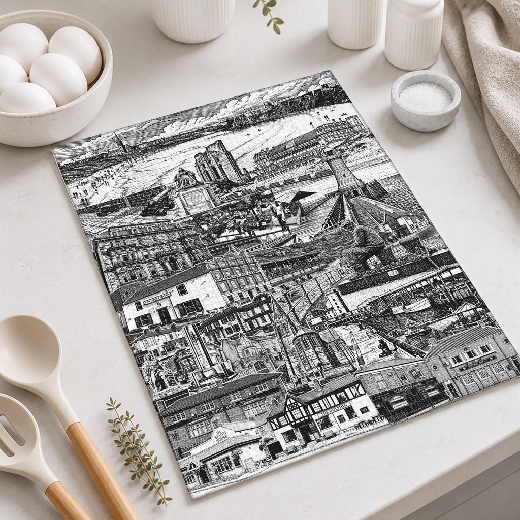 Black and white cityscape cutting board on a kitchen counter with utensils and decor.