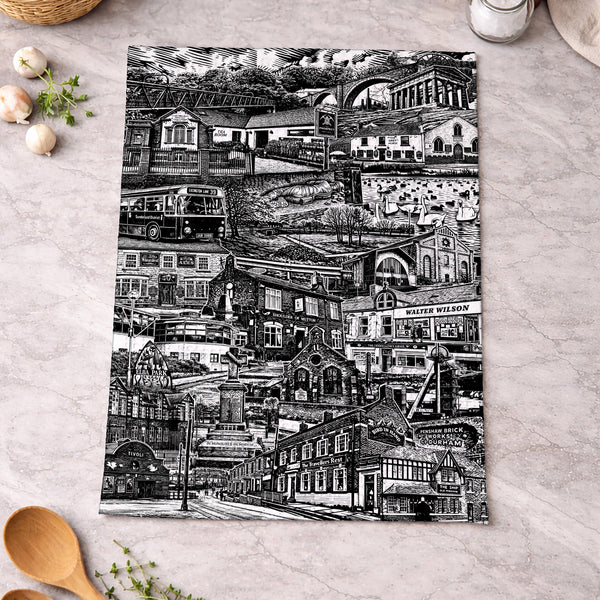 Black and white patterned towel on a kitchen counter with wooden spoons and eggs.