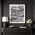 Modern interior with a dark wall, wooden console table, and framed artwork.