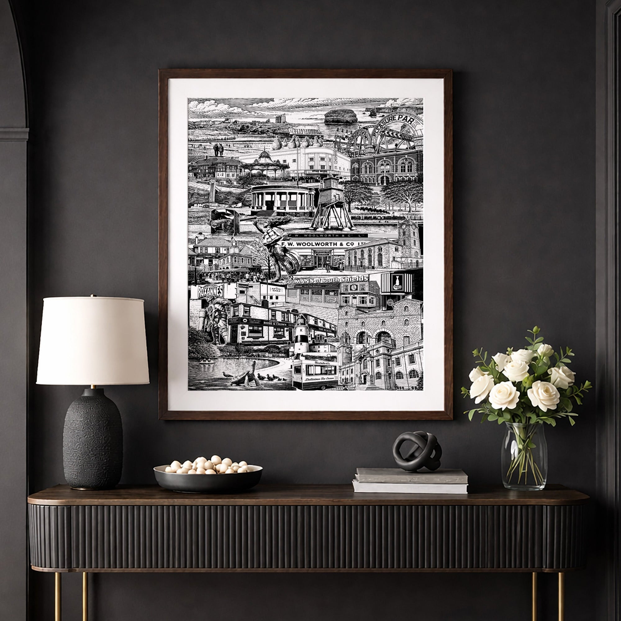 Modern interior with a dark wall, wooden console table, and framed artwork.