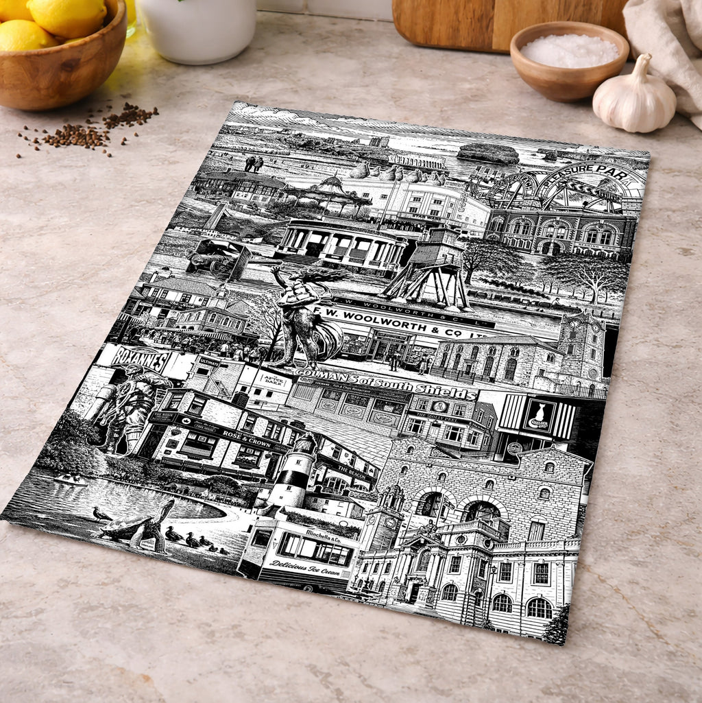 Black and white collage of architectural scenes on a kitchen countertop.