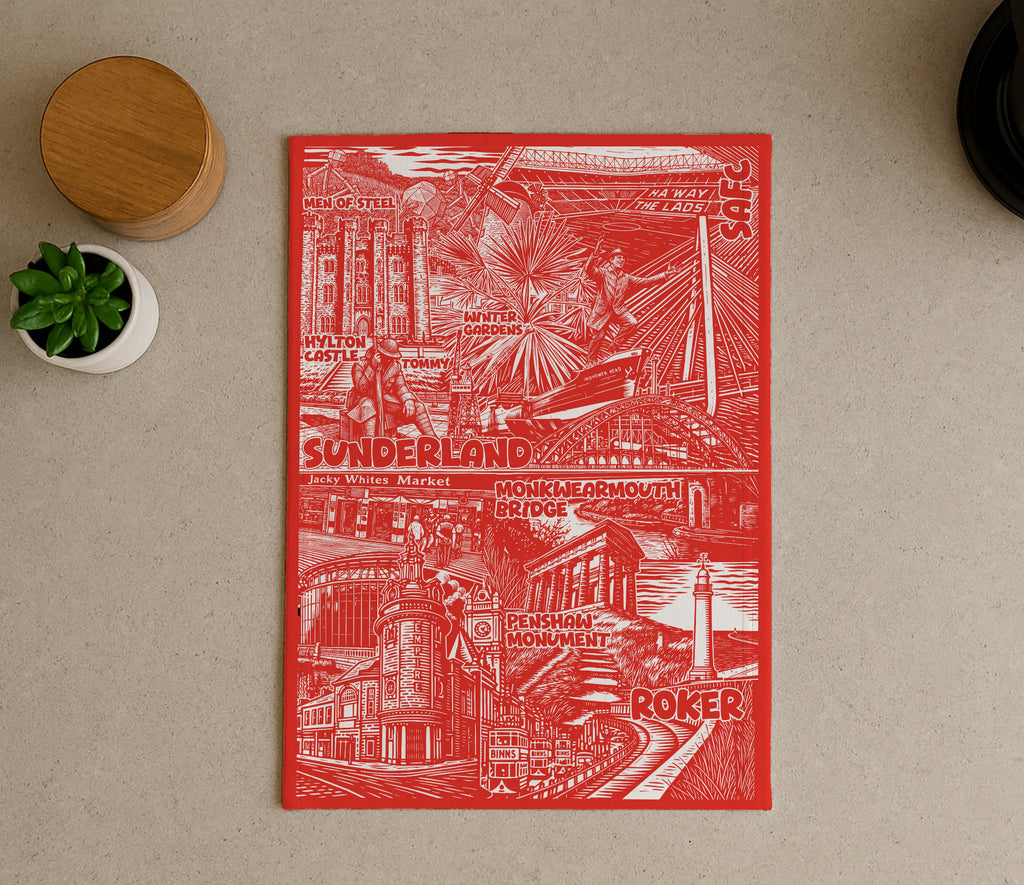 Red and white illustrated poster on a beige surface with a plant and wooden object.