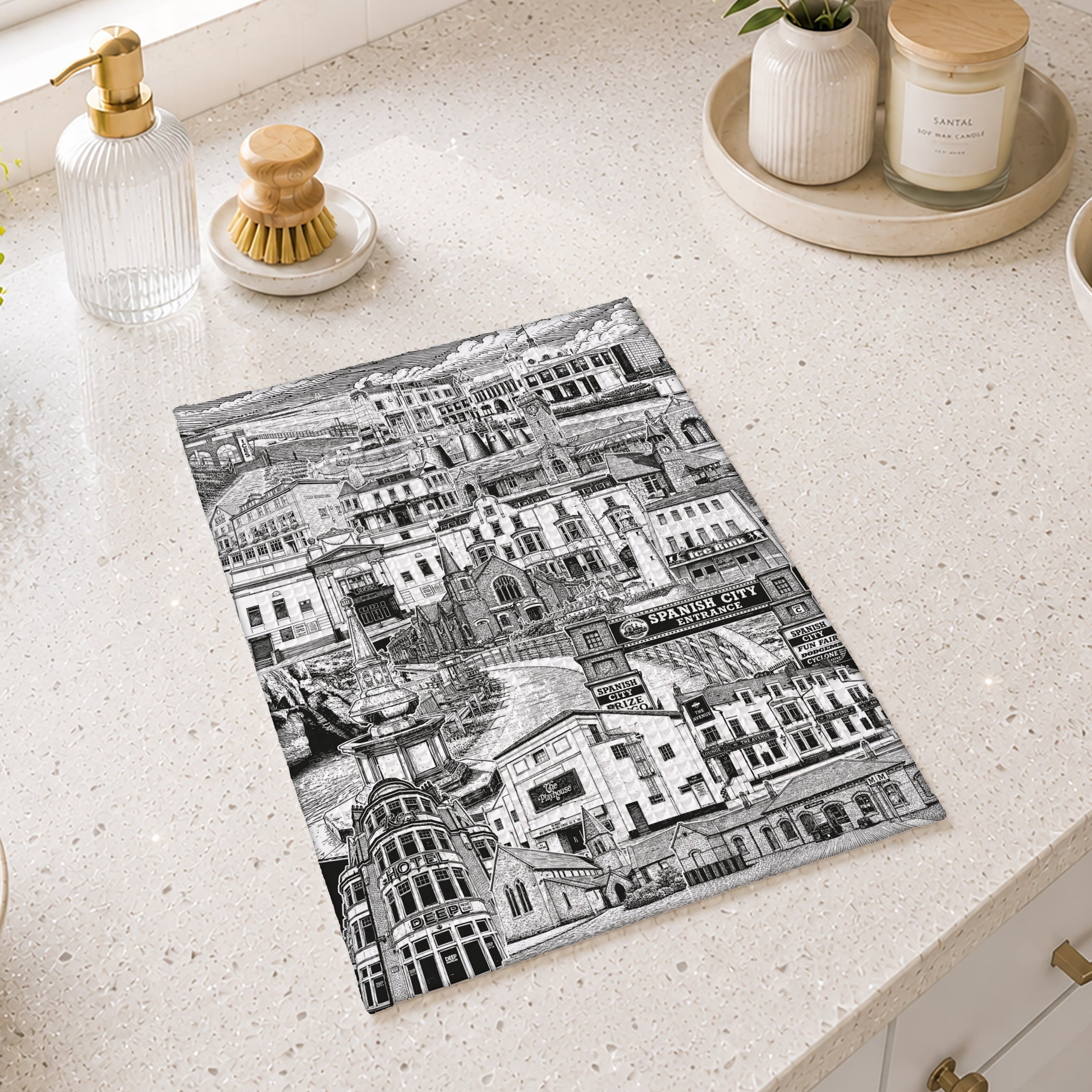 black and white tea towel cityscape design on a kitchen counter